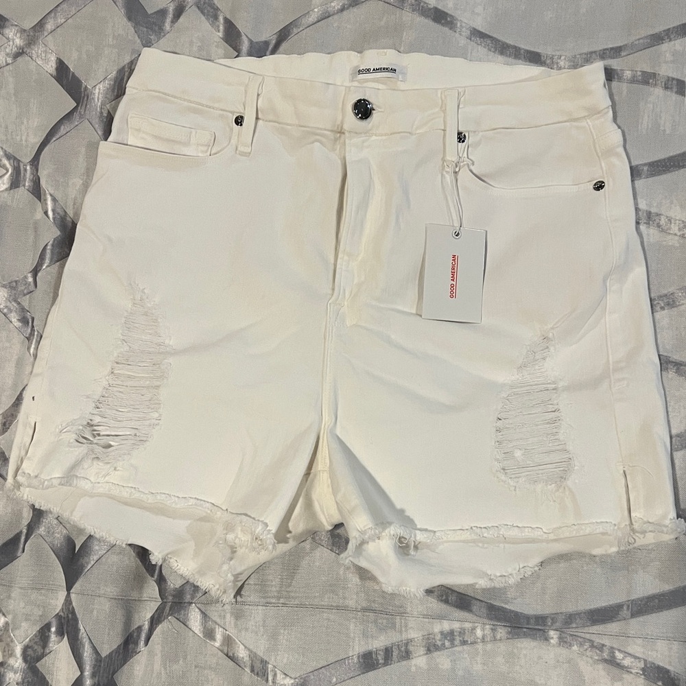 Good American NWT Distressed white shorts.  Size 16. Lots of stretch.